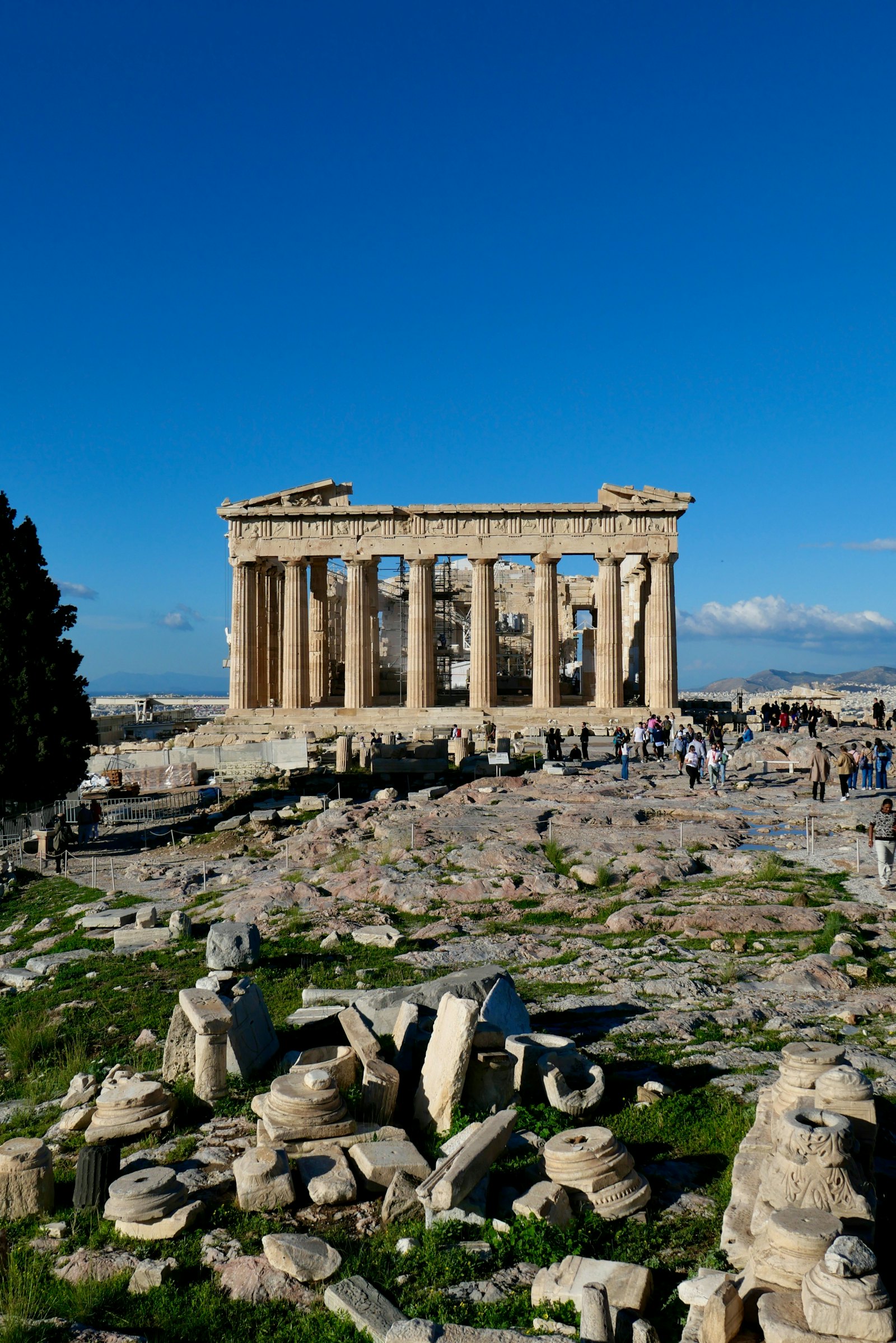 The Parthenon temple standing under a clear blue sky